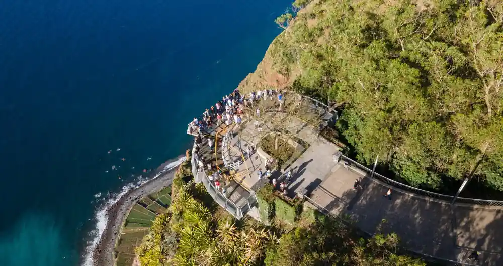 Coastal viewpoint with crowds of people